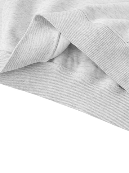 Close-up of gray fabric with a subtle pattern on a white background