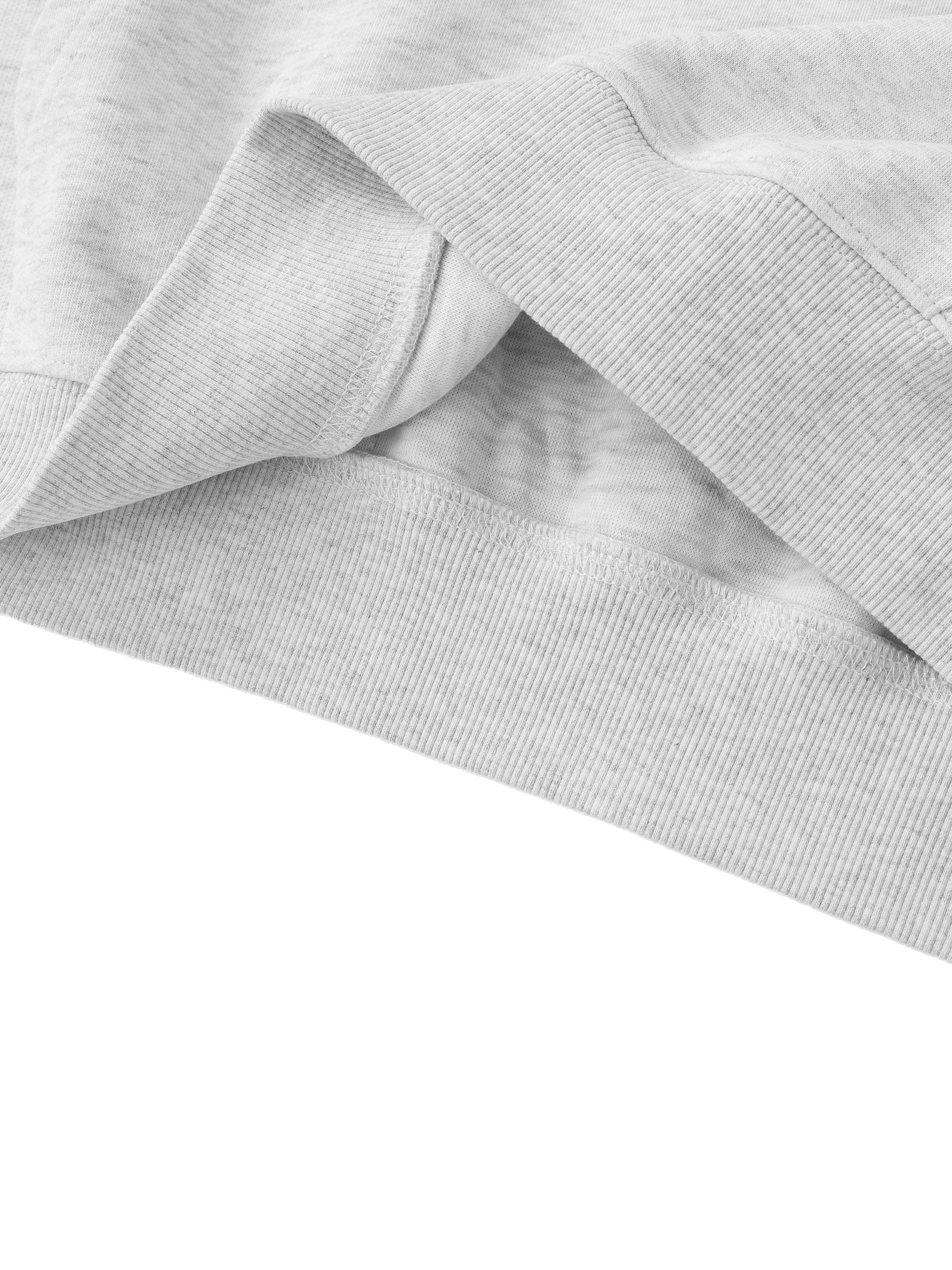 Close-up of gray fabric with a subtle pattern on a white background