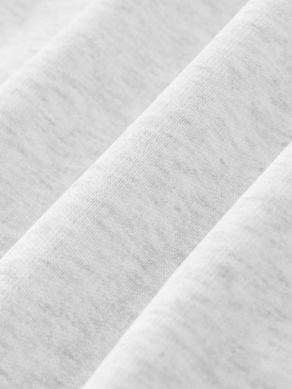 Close-up of white fabric with a subtle pattern