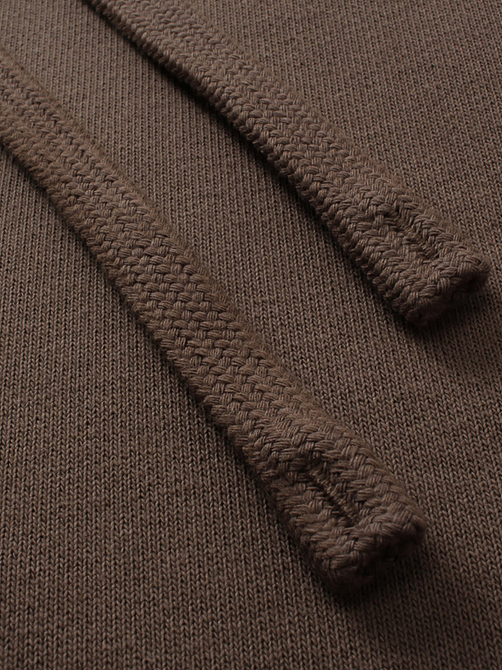 Close-up of a brown textured fabric with a focus on texture and pattern.