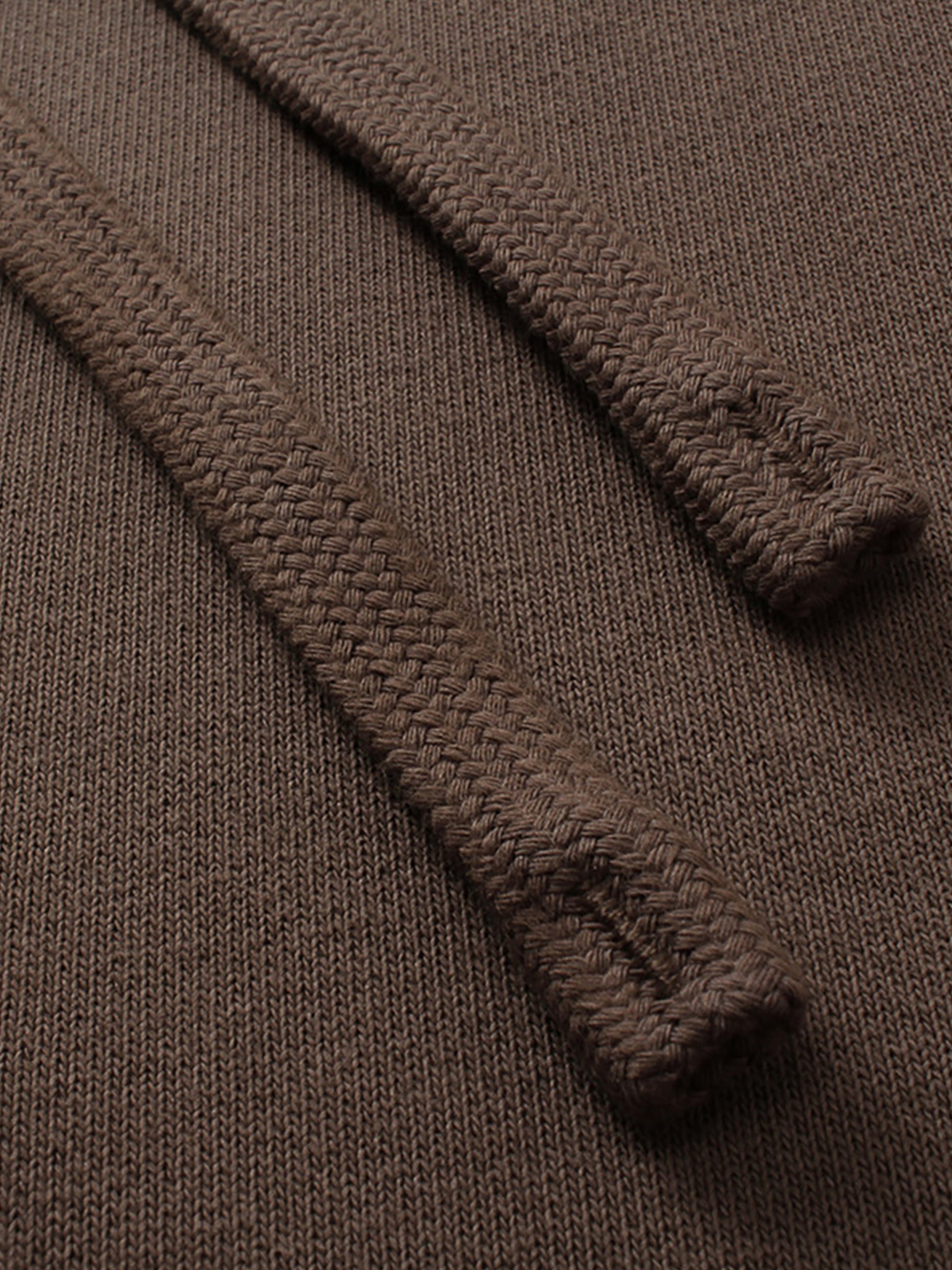 Close-up of a brown textured fabric with a focus on texture and pattern.